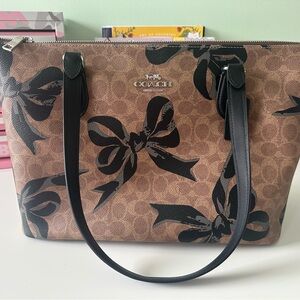 Coach Brown Signature Canvas Zip Tote with Black Bow Motif